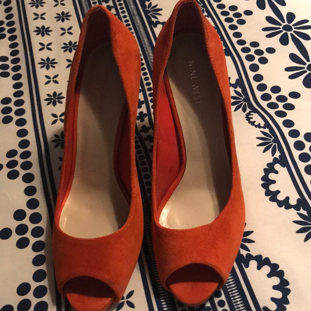 Orange suede pumps